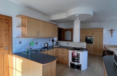 Kurtatsch an der Weinstraße House | Family apartment with playground and terrace surrounded by vineyards