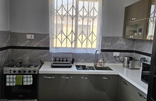 Lusaka Villa | Family & business friendly solar powered luxury 2 bed home with private pool