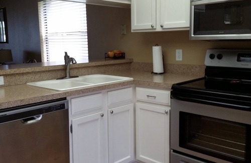 Oldsmar Condo | family friendly, gated community, two pools, lake outside back door.