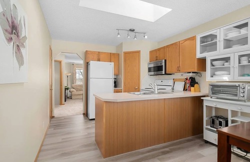 Airdrie House | Family friendly home with balcony and yard!