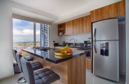 North Hotel Zone Condo | Family-Friendly 1BR + Flex | Pool, Gym, Parking