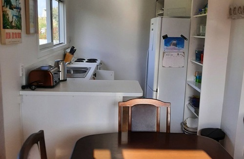 Waitarere Beach House | Family friendly, fully fenced bach, close to the beach, shops and playground.