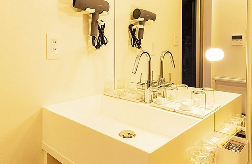 Akaogi Hotel | Family room modern kitchen with stove/Oshimagun Kagoshima