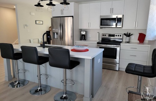 North Rustico House | Family-sized townhouse. Just minutes to the beach, golf courses & much more.
