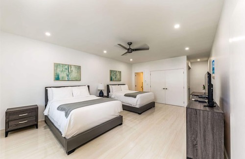 The Bight Hotel | Family Suite — 4 Queen Beds, Sleeps 8 — Pool, Bikes, Steps to Grace Bay Beach