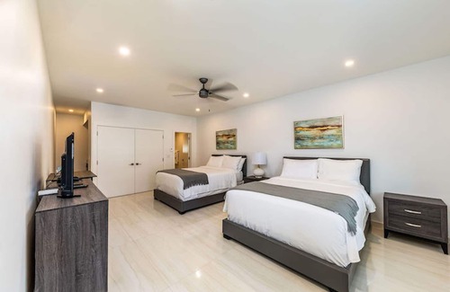 The Bight Hotel | Family Suite — 4 Queen Beds, Sleeps 8 — Pool, Bikes, Steps to Grace Bay Beach