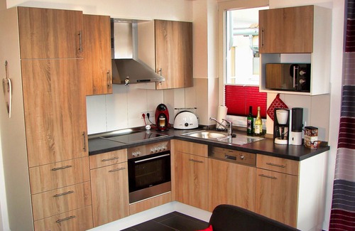 Grossenbrode Apartment | Fantastic apartment with fireplace, rain shower and sauna, wireless internet