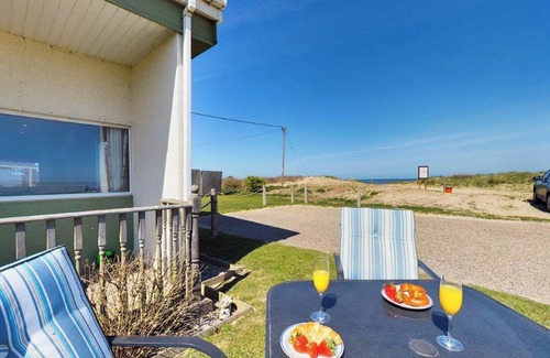 Bacton Cottage | Fantastic chalet located alongside the beach.