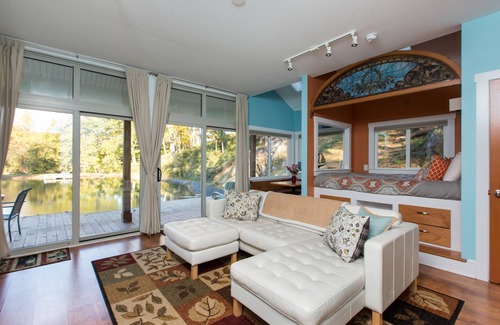 Front Royal Cabin | Fantasy Getaway Cottage on Private Pond with Waterfall, Rock Pool and Hot Tub