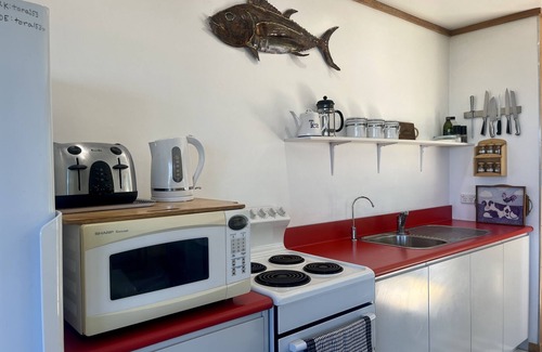 Tora Cottage | Far Side Bach Tora - pristine NZ coastline on your doorstep
