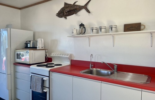 Tora Cottage | Far Side Bach Tora - pristine NZ coastline on your doorstep