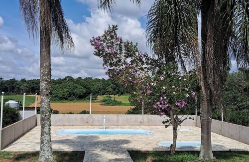 Mato do Gado House | Farm with swimming pool, fireplace and gourmet space surrounded by greenery.