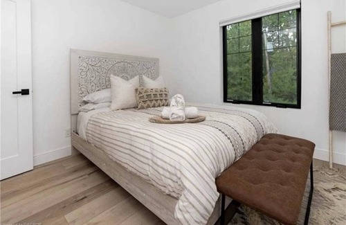 Kemble House | Farmhouse chic on Georgian Bluffs, where luxury meets comfort.
