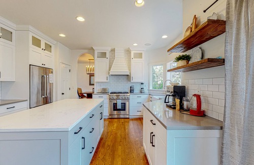 Larkspur House | Farmhouse style home with gourmet kitchen and fenced yard