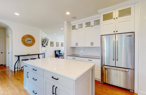 Larkspur House | Farmhouse style home with gourmet kitchen and fenced yard