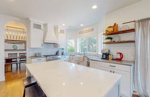 Larkspur House | Farmhouse style home with gourmet kitchen and fenced yard