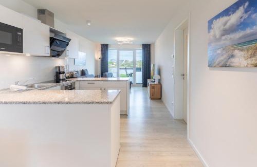 Norderhafen Apartment | Ferienwohnung Nordseetraum direkt am Nordseedeich mit Blick auf den See