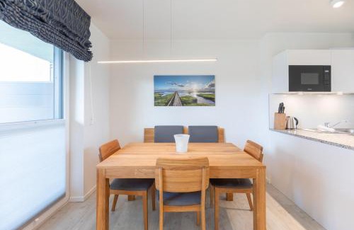 Norderhafen Apartment | Ferienwohnung Nordseetraum direkt am Nordseedeich mit Blick auf den See