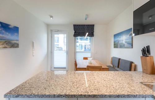 Norderhafen Apartment | Ferienwohnung Nordseetraum direkt am Nordseedeich mit Blick auf den See