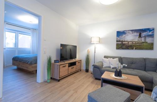Dorumer Neufeld Apartment | FeWo Seebrise mit Sauna und Balkon
