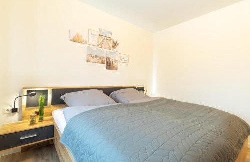 Dorumer Neufeld Apartment | FeWo Seebrise mit Sauna und Balkon
