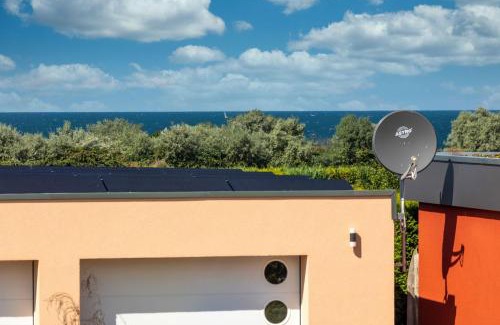 Nienhagen Ski Chalet | Finnhütte mit Kamin und Meerblick - Balkon