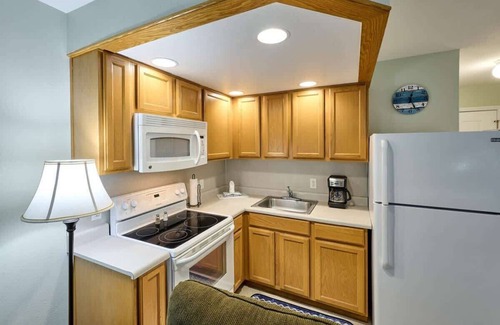 Logsden Condo | Fireplace Studio - Ground Level - Beach Access - Pool & Hot Tub!