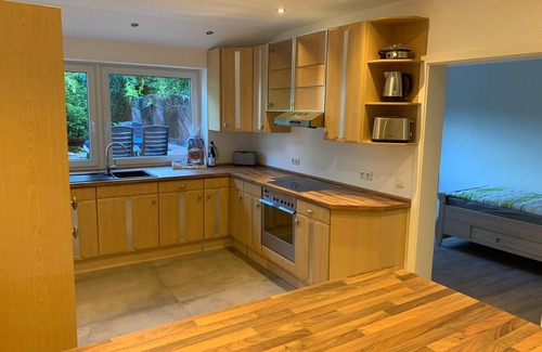 Langwedel Apartment | First floor vacation apartment on approx. 78 sqm, high-quality and modern furnishings with furnished terrace with garden pond and barbecue facilities, covered e-bike charging station and lockable bicycle room. You can look forward to: a fully equipped.