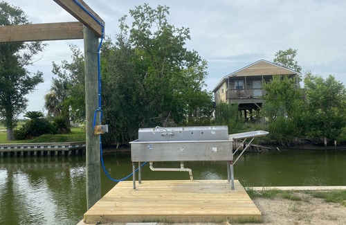 Hackberry House | Fishing camp with water access and boat house