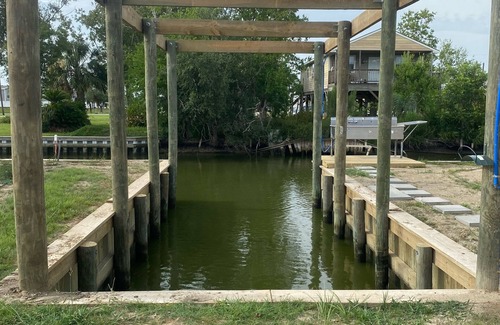Hackberry House | Fishing camp with water access and boat house