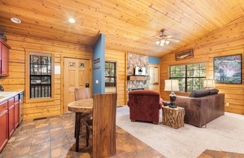 Branson Theater District Cabin | Fishing Themed Retreat for Two - King Bed Cabin with Fireplace & Jacuzzi Tub