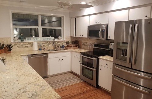 Palm Island House | Florida Island paradise! Pool, Dock, poolside bar and TV. Close to beach.