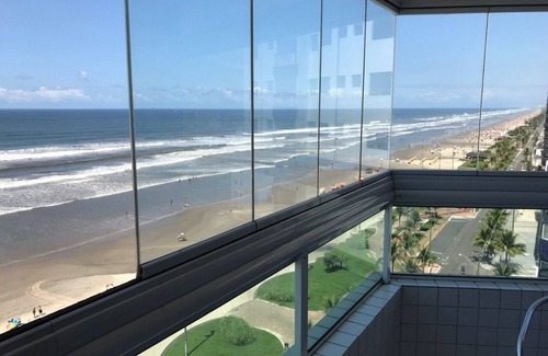 Caicara Apartment | Foot in the sand with barbecue on the balcony facing the sea, children welcome