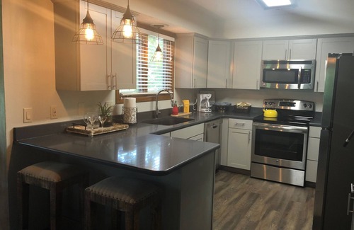 Mount Ida Condo | Forest view, log-sided two bedroom, two bath condo on Lake Ouachita. by RedAwning