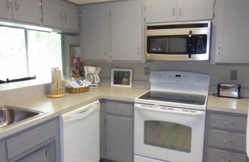 Mount Ida Condo | Forest view two bedroom, two bath condo on Lake Ouachita, steps away from pool and spa. by RedAwning