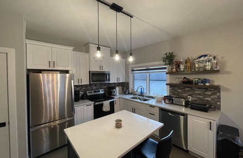 Saskatoon House | Four bedroom four bathroom townhouse with free parking for 4 vehicles.