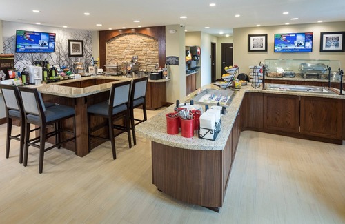 West Omaha Condo | Free Breakfast. Pool. Near the Nebraska Medical Center!
