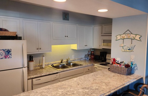 Thomas Drive Condo | Freshly updated beachfront condo with stunning views. Sleeps 4. Onsite Pool.