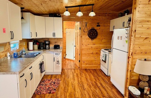 Minnedosa Cabin | Front row cabin, steps away from Minnedosa Beach, sleeps 6