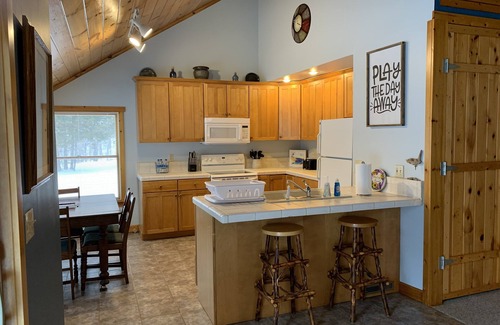 Carp Lake House | Full Home Rental on Paradise Lake. 2 Acres/60 ft of Lakefront & Private Dock