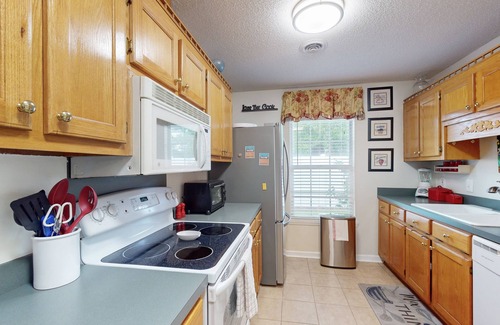 Myrtle Beach House | Fully equipped kitchen, cozy living room, enclosed yard with firepit
