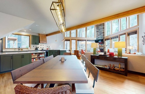 Vida House | Fully rebuilt riverfront home with deck, fireplace, & W/D - dog-friendly