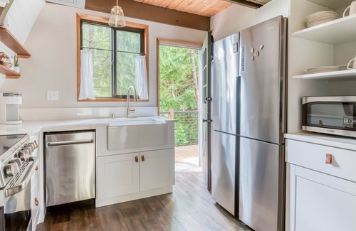 South Beach House | Fully Remodeled, Modern A-Frame Gem with Hot Tub, Deck, and Fire Pit!