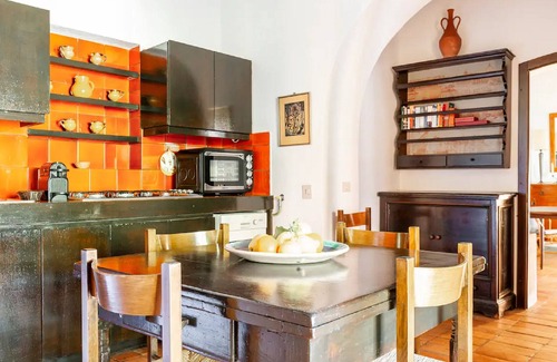 Castagneto Carducci Apartment | Garden Apartment with Sea view - hilltop Medieval village, 10' from the Beach.