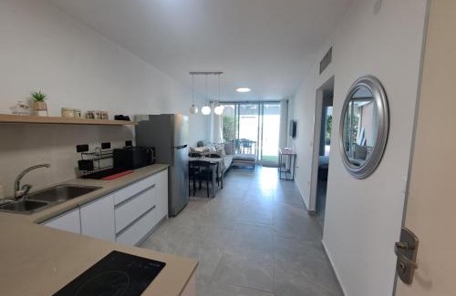 Caesarea Apartment | Garden apartment in Neot Golf, with sea view