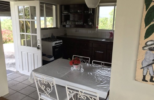 St. Patrick House | Garden Cottage with sweeping lawn view to the Caribbean Sea and islands