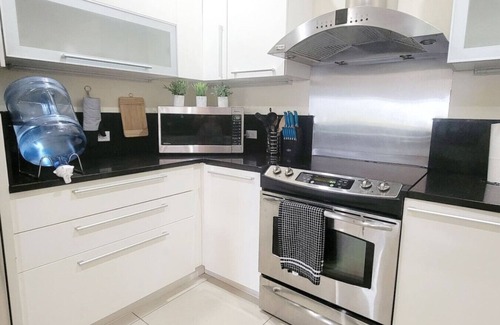 Bahamas Terrace Condo | Gated condo w/boat dock/beach/pool/hot tub