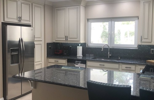 St. David's Island House | Gated Grand Harbor Townhome with beautiful views of the golf course and water