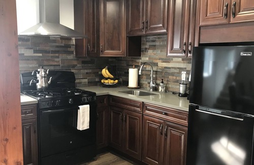 Tarzana House | Gated Guesthouse with Tennis Court, EV charging outlet.