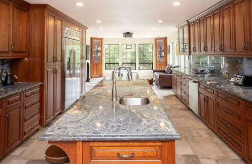 Alta Sierra Villa | Gated Tudor-Style Estate Enormous Chef's Kitchen Hot Tub Lush Landscaping